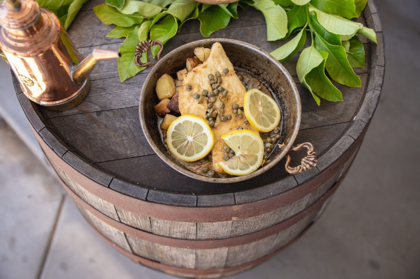 Fish with lemons and capers dish closeup